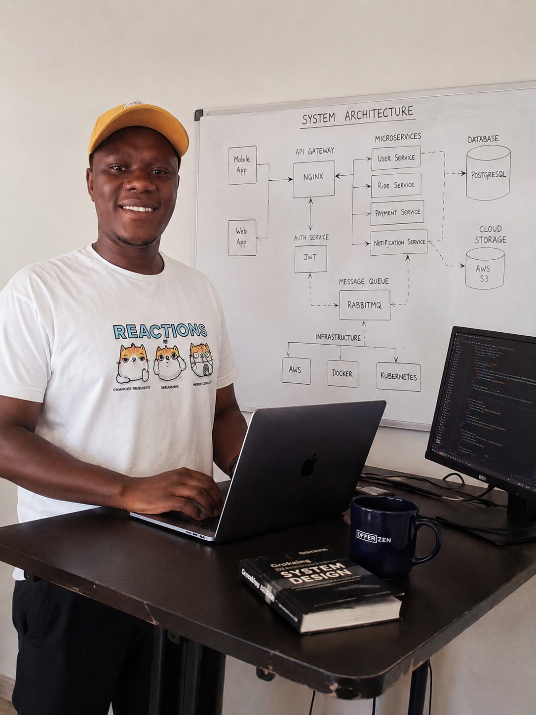 Senior engineer sketching system architecture on a whiteboard
